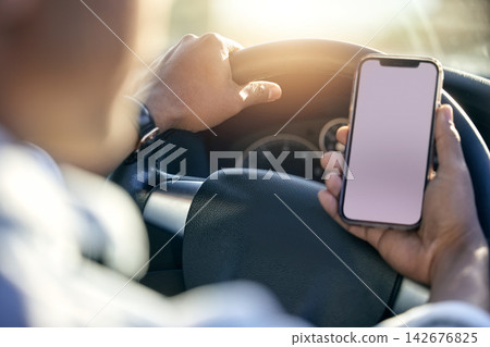 Screen, cellphone and hands of person in car for navigation, map and direction to location while driving. Driver, search and smartphone for connection, destination and route discover in vehicle Screen, cellphone and hands of person in car for navigation, map and direction to location while driving. Driver, search and smartphone for connection, destination and route discover in vehicle 142676825