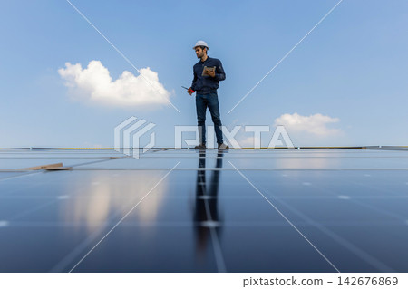 Engineer service check installation solar cell on the roof of factory. Engineer service check installation solar cell on the roof of factory. 142676869