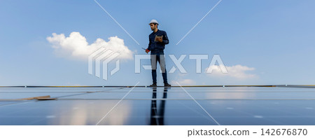 Engineer service check installation solar cell on the roof of factory. Engineer service check installation solar cell on the roof of factory. 142676870