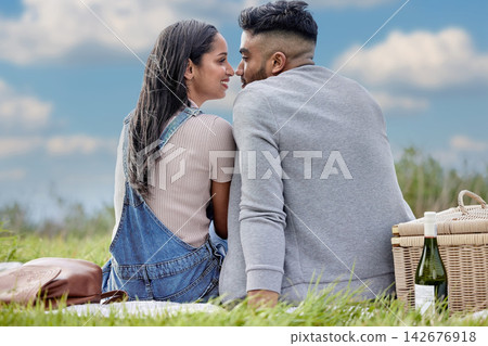 Man, woman and love in nature for date, picnic and wine for relax in field. Couple, affection and romantic in park for celebration, anniversary and vacation or travel to countryside together Man, woman and love in nature for date, picnic and wine for relax in field. Couple, affection and romantic in park for celebration, anniversary and vacation or travel to countryside together 142676918