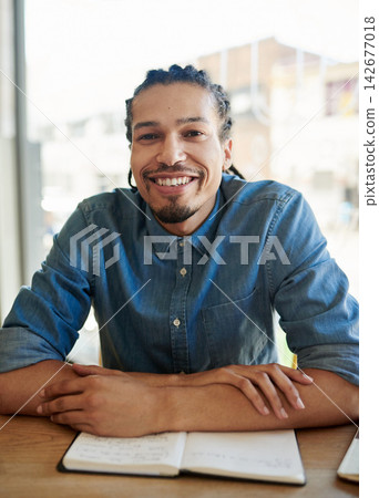 Portrait, man and smile as university student with notebook on campus to study for exams, test and assignment. College learner, happy and satisfied with learning, progress and development in table Portrait, man and smile as university student with notebook on campus to study for exams, test and assignment. College learner, happy and satisfied with learning, progress and development in table 142677018