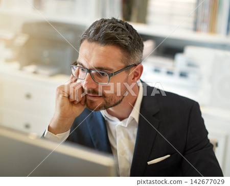 Thinking, reading or businessman with computer in office for internet, research or information for web. Legal, justice or attorney with glasses for online search, idea or planning court case defense 142677029