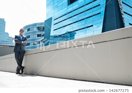 City, arms crossed and mature man in portrait for corporate company, professional career and ceo. Person, confidence and pride in urban outdoor of businessman, executive and positivity in Canada City, arms crossed and mature man in portrait for corporate company, professional career and ceo. Person, confidence and pride in urban outdoor of businessman, executive and positivity in Canada 142677275