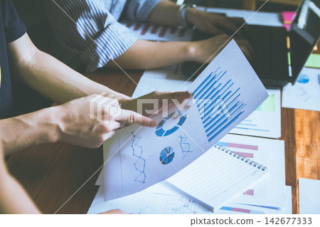 Business Meeting with graph, Growth Analysis, Charts on paper statistics data finance business Presentation to the teamwork Business Meeting with graph, Growth Analysis, Charts on paper statistics data finance business Presentation to the teamwork 142677333