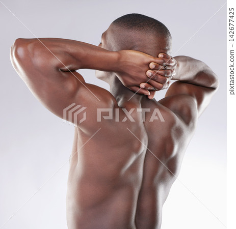 Black man, fitness and back with stretching in studio for skincare, body health and dermatology. Male person, bodybuilder and relax on white background with smooth skin, self care and satisfaction 142677425