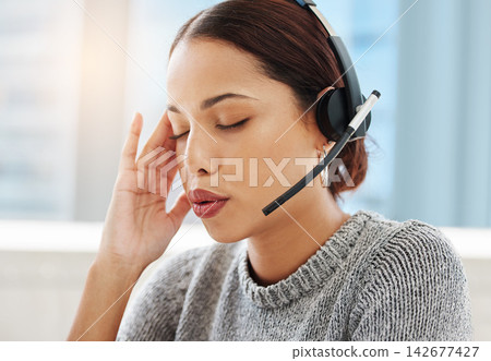 Call center, anxiety and woman with stress headache in office consulting for crm, contact us or faq with migraine. Burnout, vertigo and lead generation consultant frustrated by brain fog or mistake Call center, anxiety and woman with stress headache in office consulting for crm, contact us or faq with migraine. Burnout, vertigo and lead generation consultant frustrated by brain fog or mistake 142677427