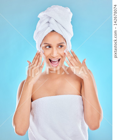 Woman, smile and cream for skincare in studio on blue background with routine, ingredients and satisfied for results. Wow, natural and happy in confidence with facial treatment and skin lotion 142678074