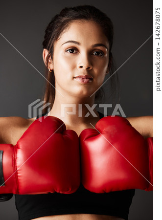 Ready, boxer or portrait of woman in boxing training, exercise or workout in gym studio for wellness. Red gloves, female athlete or strong girl with confidence, fitness or power on grey background 142678075