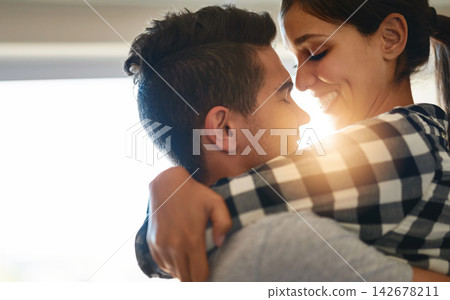 Couple, hug and home with joy, love and romance in a living room with trust and fun. Support, house and happy people with marriage and smile in lounge with embrace and laughing together with wife Couple, hug and home with joy, love and romance in a living room with trust and fun. Support, house and happy people with marriage and smile in lounge with embrace and laughing together with wife 142678211
