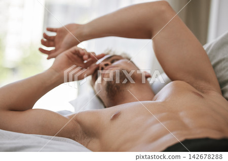 Morning, wake up or man in bedroom for resting in home, house or apartment with six pack abs. Topless, relax or calm male person sleeping on break with peace or ready to start day or chill on weekend Morning, wake up or man in bedroom for resting in home, house or apartment with six pack abs. Topless, relax or calm male person sleeping on break with peace or ready to start day or chill on weekend 142678288
