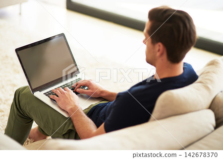 Sofa, screen and man with laptop in home for information, freelance project and digital report. High angle, remote work and male person with tech for communication, connection and copywriting website Sofa, screen and man with laptop in home for information, freelance project and digital report. High angle, remote work and male person with tech for communication, connection and copywriting website 142678370