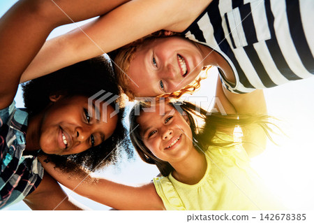Happy, low angle and portrait of kids on camp for friendship, playing and fun together. Diversity, youth and girls huddle in circle for childhood, game and support at school, recess and playground Happy, low angle and portrait of kids on camp for friendship, playing and fun together. Diversity, youth and girls huddle in circle for childhood, game and support at school, recess and playground 142678385