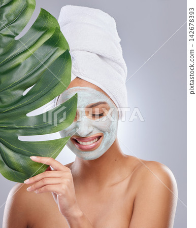 Leaf, woman and face mask for skincare, cosmetic and facial treatment on white background. Beauty, natural or organic for female person, smile and flower for dermatology detox and exfoliate product Leaf, woman and face mask for skincare, cosmetic and facial treatment on white background. Beauty, natural or organic for female person, smile and flower for dermatology detox and exfoliate product 142678393