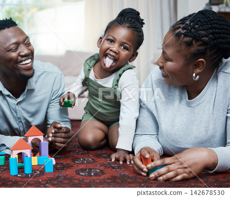 Black family, portrait or girl with parents or building blocks for playing, creative fun or bonding in home. Love, mom or happy kid on floor with dad, games or toys for child development or learning Black family, portrait or girl with parents or building blocks for playing, creative fun or bonding in home. Love, mom or happy kid on floor with dad, games or toys for child development or learning 142678530