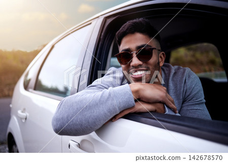 Happy, adventure and man in car window with smile for travel or road trip with relaxing journey in summer. Break, transport and holiday or vacation to Sweden with ride in countryside for view. 142678570