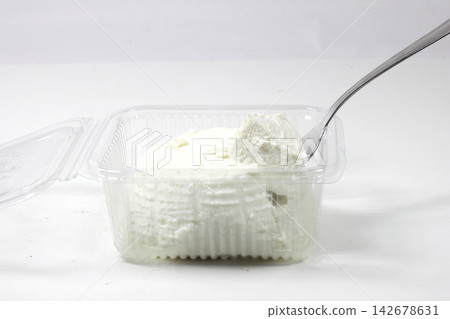 someone took a bite of cow's milk ricotta using a fork- someone took a bite of cow's milk ricotta using a fork- 142678631