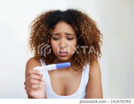 Black woman, anxiety and fear in house with pregnancy test for baby, infertility and future family. Girl, stress and scared with testing kit in home for motherhood, child and ivf results by mockup Black woman, anxiety and fear in house with pregnancy test for baby, infertility and future family. Girl, stress and scared with testing kit in home for motherhood, child and ivf results by mockup 142678768