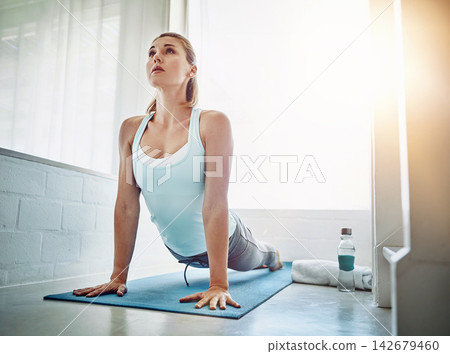 Home, woman and stretching with fitness, wellness and routine with endurance, flexible and workout. Person, apartment and girl on yoga mat, training and healthy with progress, breathing and exercise Home, woman and stretching with fitness, wellness and routine with endurance, flexible and workout. Person, apartment and girl on yoga mat, training and healthy with progress, breathing and exercise 142679460