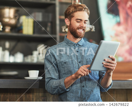 Man, tablet and business owner with typing in coffee shop for planning, reading and contact for deal on stock. Person, entrepreneur and touchscreen with research for organic supplier on web in cafe Man, tablet and business owner with typing in coffee shop for planning, reading and contact for deal on stock. Person, entrepreneur and touchscreen with research for organic supplier on web in cafe 142679822