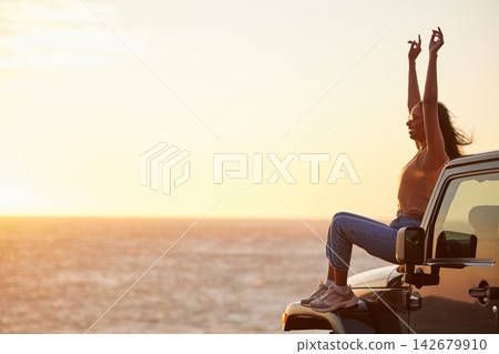 Sunset, car and happy woman with freedom by the sea with road trip adventure and journey by the ocean. Excited, travel and spring break with motor in Miami with holiday and vacation fun with mockup Sunset, car and happy woman with freedom by the sea with road trip adventure and journey by the ocean. Excited, travel and spring break with motor in Miami with holiday and vacation fun with mockup 142679910