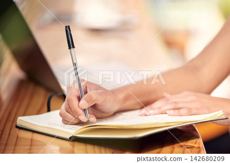 Writing, hands and florist with notebook for inventory, stocktake or order products in office. Small business, entrepreneur and person with pen at nursery for planning, checklist or price list 142680209