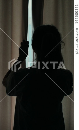 Vertical video. Morning Motivation: Woman Embraces New Day in Modern Home. Vertical video. Morning Motivation: Woman Embraces New Day in Modern Home. 142680351