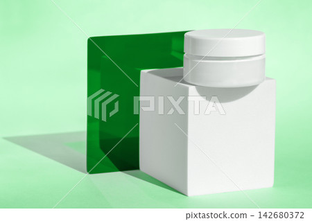 Cosmetic container and white cream jar on geometric background Cosmetic container and white cream jar on geometric background 142680372