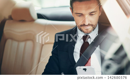 Businessman, reading or commute with phone in car for news update, travel or browsing. Passenger, chat or banker on mobile app for social media or online texting in vehicle, taxi or cab for work trip Businessman, reading or commute with phone in car for news update, travel or browsing. Passenger, chat or banker on mobile app for social media or online texting in vehicle, taxi or cab for work trip 142680376