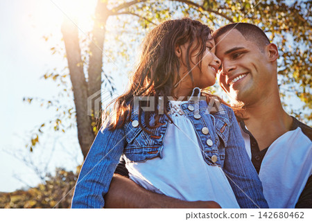 Happy, hug and dad with girl in park on adventure in summer with trees on farm, orchard or relax in garden. Father, love and care for child on vacation, holiday or travel in environment with family Happy, hug and dad with girl in park on adventure in summer with trees on farm, orchard or relax in garden. Father, love and care for child on vacation, holiday or travel in environment with family 142680462
