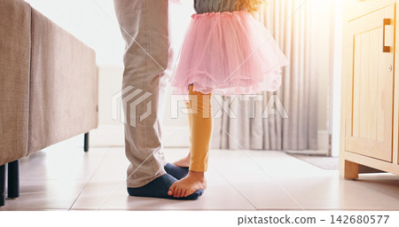 Father, child and dancing on feet in home with music, radio or bonding with love in living room. Dancer, energy or girl in ballerina dress in lounge with teaching, steps or movement in house for care 142680577