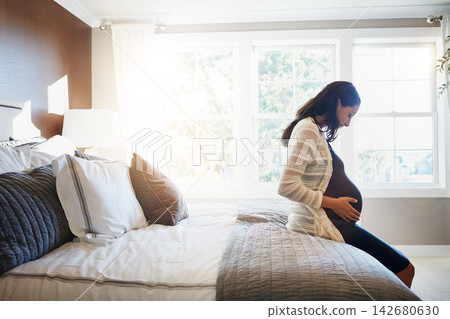 Bedroom, excited and pregnant woman with happiness, relax and healthy with fertility, wellness and stomach. Person, home and girl with pregnancy, motherhood and sunshine with maternity leave and ivf Bedroom, excited and pregnant woman with happiness, relax and healthy with fertility, wellness and stomach. Person, home and girl with pregnancy, motherhood and sunshine with maternity leave and ivf 142680630