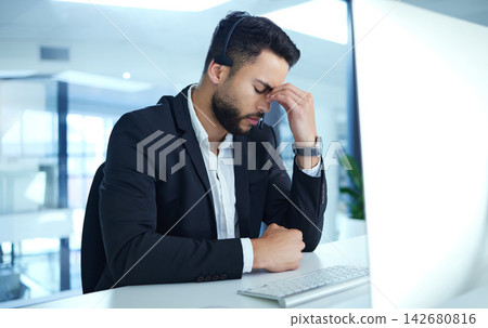 Man, headache and frustrated in call center with computer in office, stress and anxiety from customer support. Worker, operator and telemarketing with sales consultant, mental health and tired. Man, headache and frustrated in call center with computer in office, stress and anxiety from customer support. Worker, operator and telemarketing with sales consultant, mental health and tired. 142680816