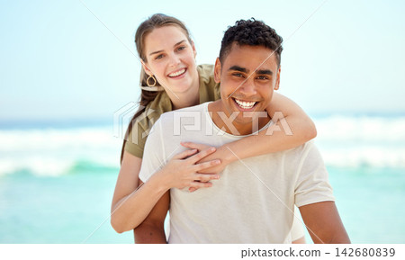 Hug, piggyback and portrait of couple at beach together for holiday, travel or vacation in summer. Happy, love or smile with man and woman outdoor by ocean or sea for coastal and tropical getaway Hug, piggyback and portrait of couple at beach together for holiday, travel or vacation in summer. Happy, love or smile with man and woman outdoor by ocean or sea for coastal and tropical getaway 142680839