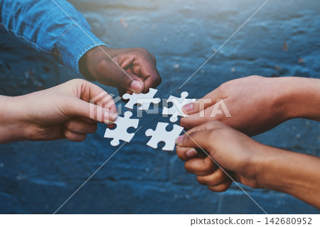 Teamwork, business and hands of people with puzzle for unity or collaboration with joint effort for project. Group, diversity and pieces together for planning or partnership, union and engagement. Teamwork, business and hands of people with puzzle for unity or collaboration with joint effort for project. Group, diversity and pieces together for planning or partnership, union and engagement. 142680952