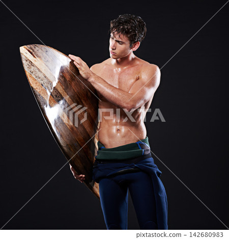 Studio, surfboard and male surfer, athlete and wetsuit isolated on black background. Body, swimsuit and water sports for man model, equipment and wooden for cardio fitness or hobby for exercise Studio, surfboard and male surfer, athlete and wetsuit isolated on black background. Body, swimsuit and water sports for man model, equipment and wooden for cardio fitness or hobby for exercise 142680983