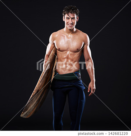 Studio, surfboard and portrait of male surfer, smile or athlete isolated on black background. Body, swimsuit or wetsuit for water sports for man model person, equipment or board for fitness or hobby 142681220