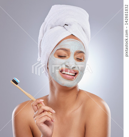 Woman, face mask and toothbrush for hygiene, cosmetics and skincare on white background. Cleaning, dental and toothpaste with product for female person, studio and towel for grooming and dermatology 142681832