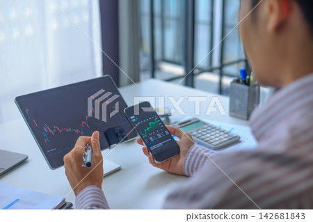 Financial Analyst Tracking Stock Portfolio Profit and Loss Data on Digital Screens in Office. Financial Analyst Tracking Stock Portfolio Profit and Loss Data on Digital Screens in Office. 142681843
