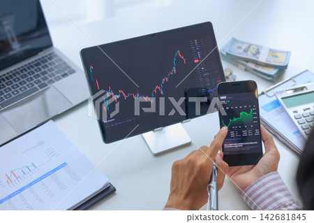 Active Day Trader Monitoring Stock Market Investment Candlestick Charts on Multiple Screens. Active Day Trader Monitoring Stock Market Investment Candlestick Charts on Multiple Screens. 142681845
