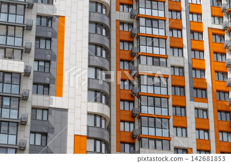 Vibrant architectural design shines on modern building facade in urban setting Vibrant architectural design shines on modern building facade in urban setting 142681853