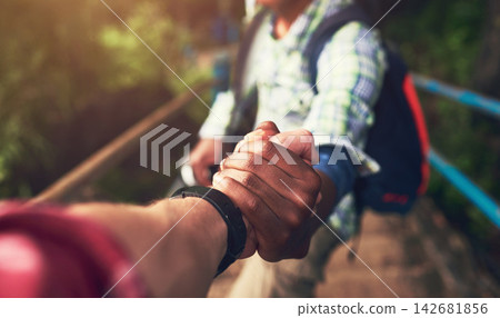 People, pov and holding hands for mountain hike or friends support for exercise challenge, trekking or fitness. Athlete, stairs and together in nature forest for cardio adventure, tourism or travel People, pov and holding hands for mountain hike or friends support for exercise challenge, trekking or fitness. Athlete, stairs and together in nature forest for cardio adventure, tourism or travel 142681856