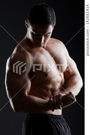 Bodybuilder, flexing or muscle for fitness goals, workout or training motivation and healthcare wellness check. Man, sports athlete or model body on aesthetic backdrop on black studio background Bodybuilder, flexing or muscle for fitness goals, workout or training motivation and healthcare wellness check. Man, sports athlete or model body on aesthetic backdrop on black studio background 142681914