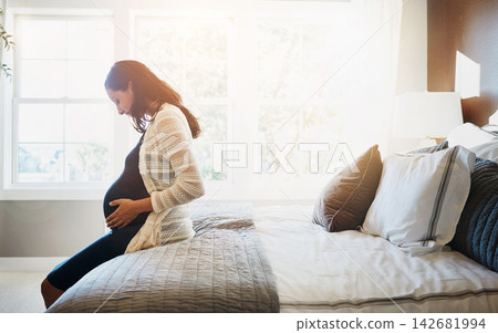 Home, excited and pregnant woman with happiness, relax and rest with fertility, wellness and cheerful. Person, bedroom and girl with pregnancy, motherhood and belly with maternity leave and healthy Home, excited and pregnant woman with happiness, relax and rest with fertility, wellness and cheerful. Person, bedroom and girl with pregnancy, motherhood and belly with maternity leave and healthy 142681994