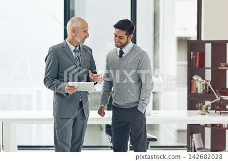 Tablet, mentor and business men in office for consulting, advice and meeting for online project. Corporate, teamwork and boss with intern on digital tech for research, website and proposal review Tablet, mentor and business men in office for consulting, advice and meeting for online project. Corporate, teamwork and boss with intern on digital tech for research, website and proposal review 142682028