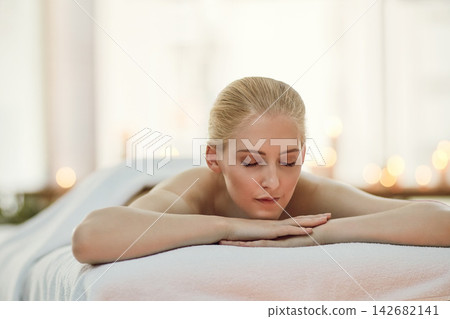 Woman, rest and bed at spa for wellness with thinking, memory and relax with aromatherapy candles. Girl, person and client at luxury resort with reflection, organic treatment and health on vacation Woman, rest and bed at spa for wellness with thinking, memory and relax with aromatherapy candles. Girl, person and client at luxury resort with reflection, organic treatment and health on vacation 142682141