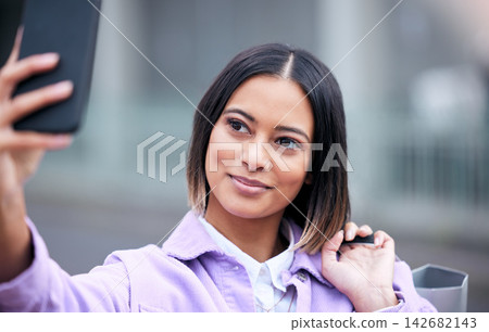 Woman, selfie and shopping bag in city with smile for deal, discount or retail sale with post on web. Girl, influencer and happy for live streaming with package, street and update for social media Woman, selfie and shopping bag in city with smile for deal, discount or retail sale with post on web. Girl, influencer and happy for live streaming with package, street and update for social media 142682143