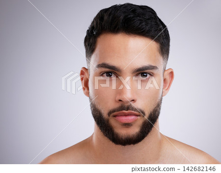 Portrait, skincare and man in studio for beauty, grooming and natural isolated on white background. Dermatology, serious face and model in cosmetics for health, wellness or clean facial aesthetic Portrait, skincare and man in studio for beauty, grooming and natural isolated on white background. Dermatology, serious face and model in cosmetics for health, wellness or clean facial aesthetic 142682146