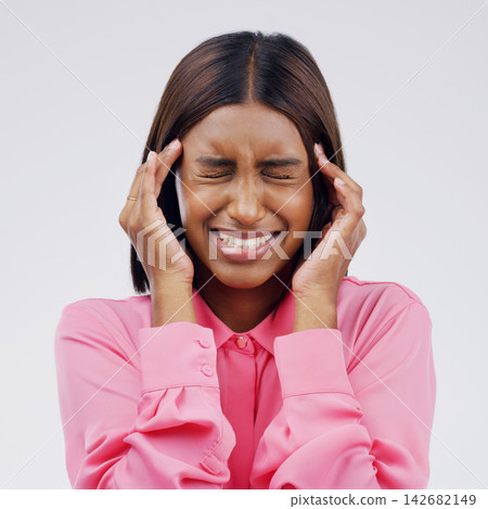 Indian woman, hands and headache pain in studio with stress pressure for fatigue, migraine or vertigo. Female person, temple and massage on white background or brain fog tension, anxiety or mockup Indian woman, hands and headache pain in studio with stress pressure for fatigue, migraine or vertigo. Female person, temple and massage on white background or brain fog tension, anxiety or mockup 142682149