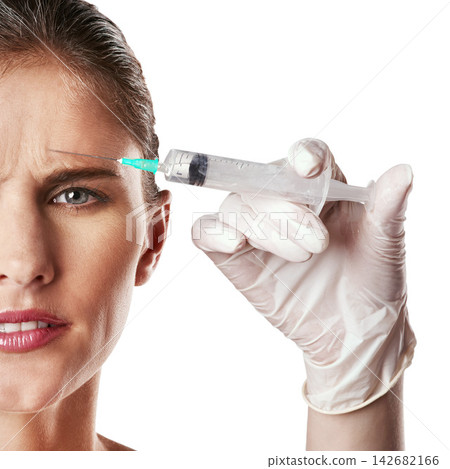 Half face, forehead and syringe in hand with glove for dermatology, skincare or beauty treatment in anti age and facial. Female person, frown and portrait for medical aesthetic on mockup space Half face, forehead and syringe in hand with glove for dermatology, skincare or beauty treatment in anti age and facial. Female person, frown and portrait for medical aesthetic on mockup space 142682166
