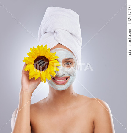 Sunflower, woman and face mask for skincare, cosmetic and facial treatment on white background. Beauty, natural or organic for female person, portrait and dermatology for detox and exfoliate product Sunflower, woman and face mask for skincare, cosmetic and facial treatment on white background. Beauty, natural or organic for female person, portrait and dermatology for detox and exfoliate product 142682175